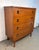 A refined American mid-century modern four-drawer chest produced by Bassett Furniture Industries, Inc., circa 1960s....