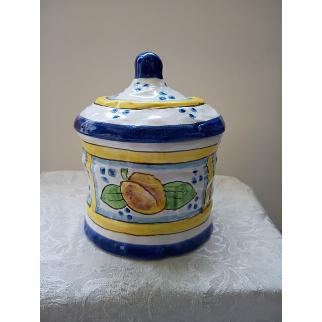 Overview: A charming, authentic vintage Italian majolica lidded canister featuring a hand-painted fruit motif...