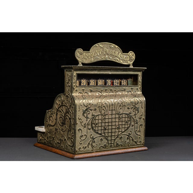 1891; National Cash Register Co. - Dayton, OH Antique brass-plated mechanical cash regsiter on a wooden base. Serial No....