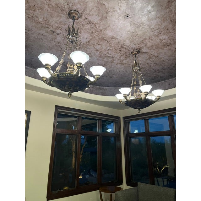These exquisite chandeliers feature a large central tortoiseshell-patterned bowl combined with multiple upward-curving...