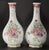 An impressive pair of porcelain vases Decorated by hand in the traditions of the Famille Rose Chinese porcelain, with...