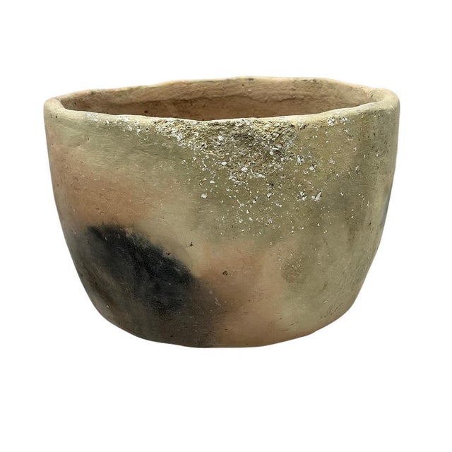 This Gafsa clay vessel hails from Tunisia, specifically the town of Gafsa known for its pottery craftsmanship. This...