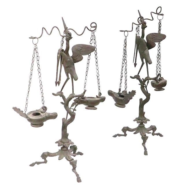 Neo Classic Grand Tour bronze candlesticks, depicting a Heron perched on a tree with a stick in its beak, mounted on...