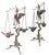Neo Classic Grand Tour bronze candlesticks, depicting a Heron perched on a tree with a stick in its beak, mounted on...
