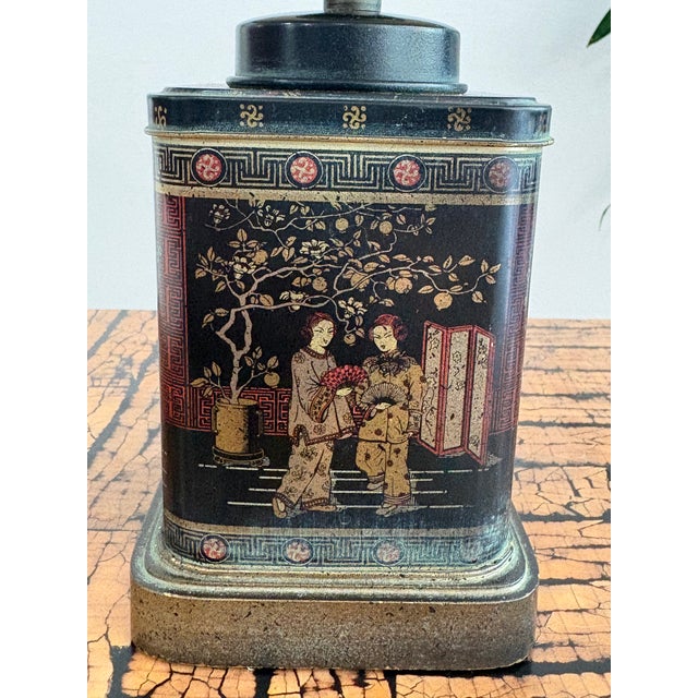 Petite table lamp in the style of Frederick Cooper.. Circa 1960's the tea canister base features several Asian scenes on...