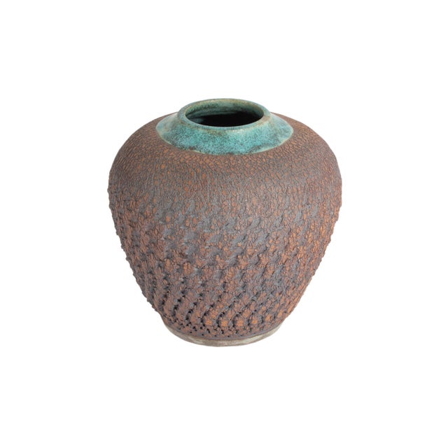 A signed studio pottery vase by the American ceramicist Barry Vantiger. This rounded vase features a turquoise rim and a...