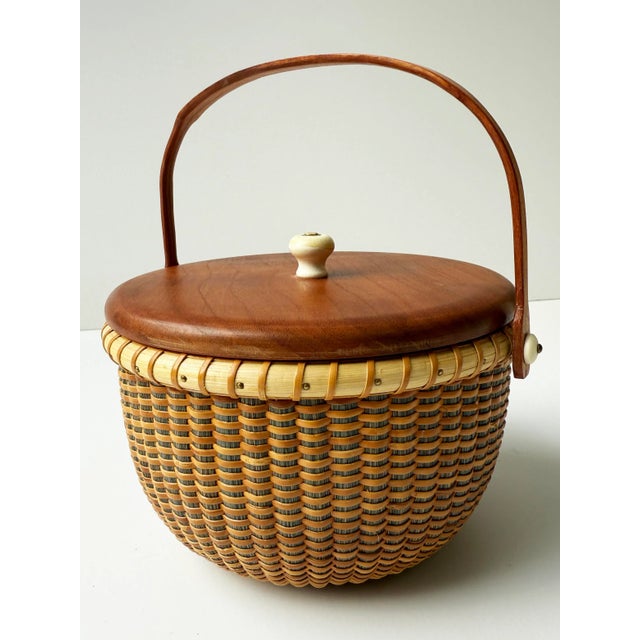 This beautifully handcrafted vintage Nantucket Lightship Basket is a signed piece, marked by the artisan on the underside....