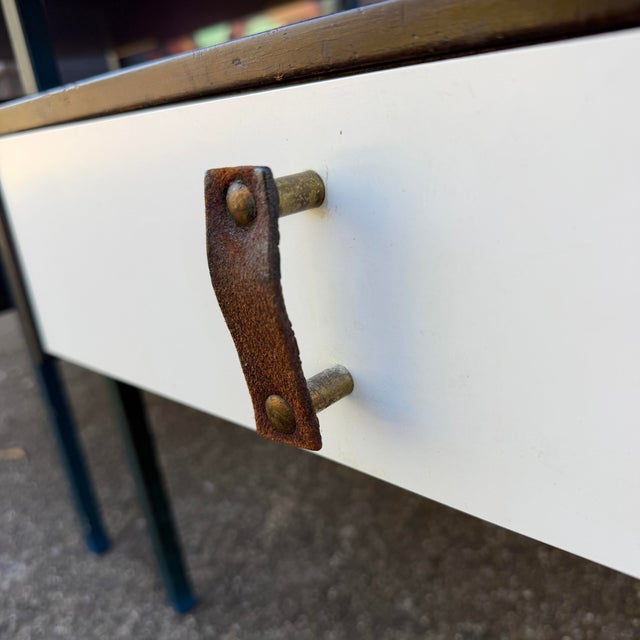 Mid-Century Moderm Vista Furniture California. They feature a steel frame, a white laminate top and drawer face with brass...