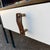 Mid-Century Moderm Vista Furniture California. They feature a steel frame, a white laminate top and drawer face with brass...