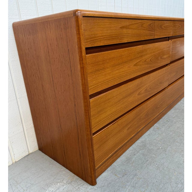 This listing is for a Vintage Danish Modern Teak 10-Drawer Dresser. Featuring a straight line design, four small drawers...