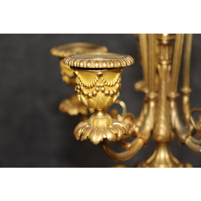 There are candleholders that exist to hold candles, and then there are candleholders that appear to be holding court,...