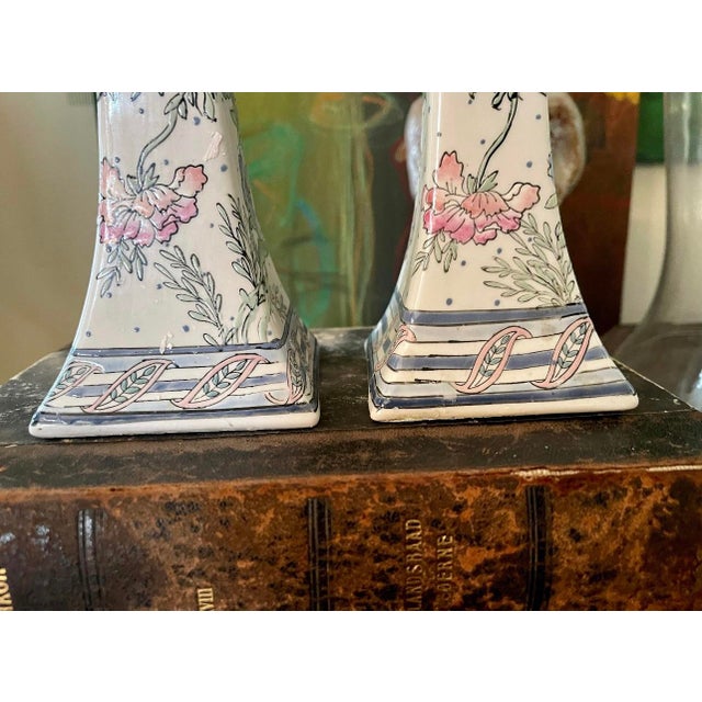 Sweet floral ceramic pair of Chinoiserie Candlestick Holders, creamy white glaze with a rosy pink floral pattern that...