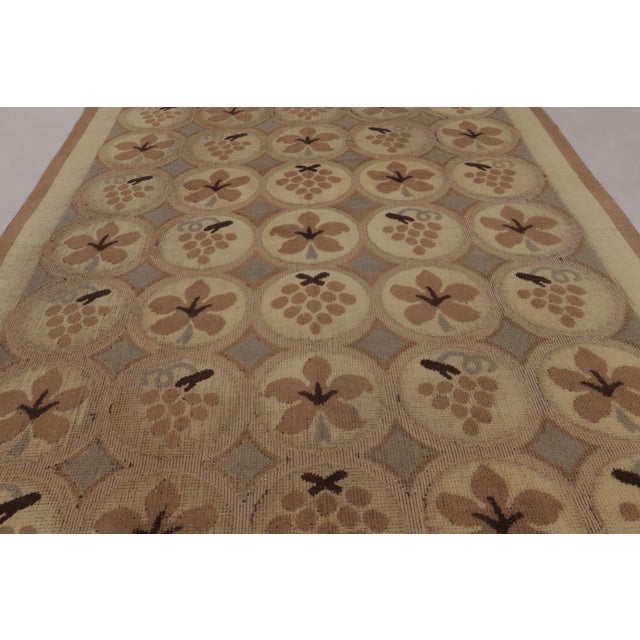 Hand-knotted in Finnish wool and originating circa 1910–1920, this 9x12 rustic Antique Scandinavian Rya Rug from Rug &...