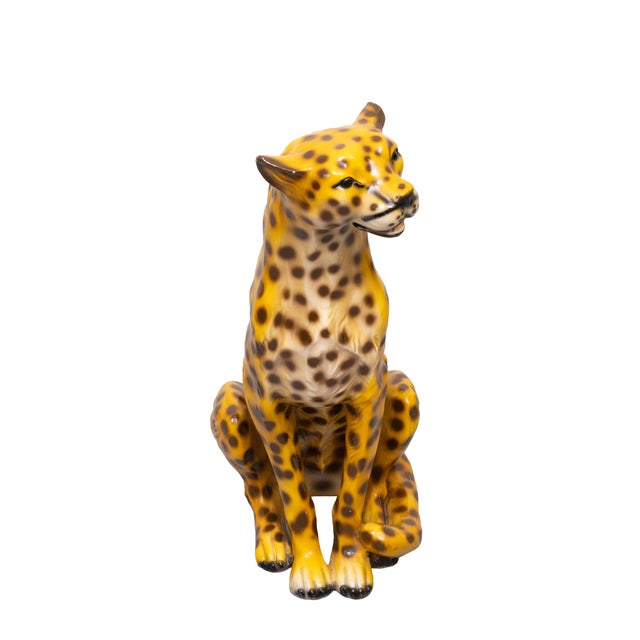 A life sized Italian ceramic wildlife cheetah sculpture. Realistically painted under glaze. A friendly looking example....