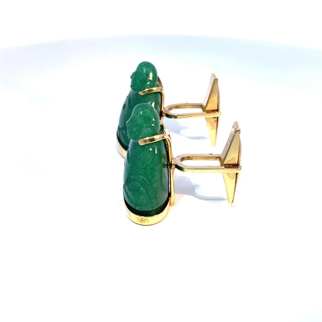 Elevate your style with these exquisite cufflinks featuring two stunning green jade Buddha cabochons set on luxurious 14k...