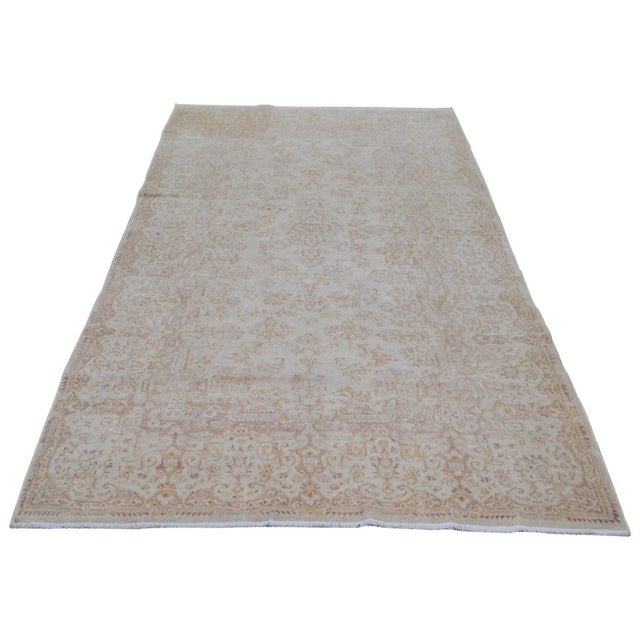 Hand-knotted with care using traditional rug-making techniques, this wool rug blends timeless craftsmanship with a modern...