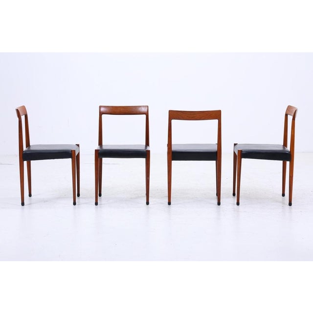Rare set of 4 teak chairs by Lübke Set of 4 dining chairs • Manufacturer: Lübke • Material: Teak wood, leather • Slim,...