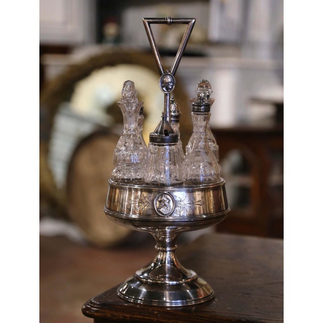 Enhance a dining table or sideboard with this elegant six-bottle cruet set, made by Reed & Barton, circa 1880. The silver-...