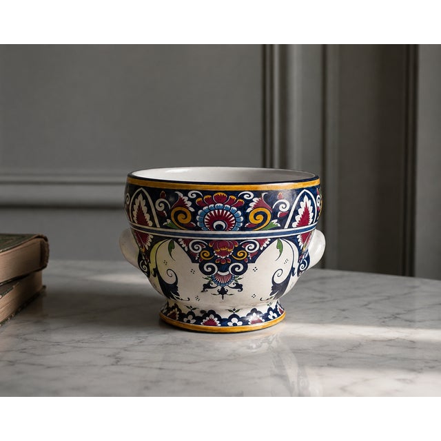 A charming vintage french hand-painted faience bowl or small vase, made in louviers, normandy, and decorated in a richly...