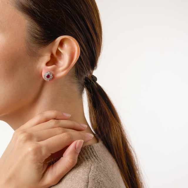 A bold and refined interpretation of classic 1930s glamour, these Art Deco–inspired stud earrings center on two vivid...