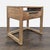 This teak nightstand, with an airy, open-frame base, features a storage drawer with a horizontal pull in gunmetal-finished...