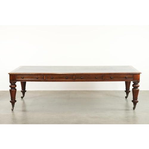 We are pleased to offer this uniquely large and imposing antique English library table/writing desk/desk from the 19th...