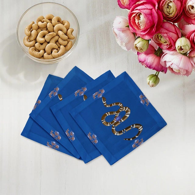 Thistle And Snake Cocktail Napkins intertwine thistle floral patterns with bold serpent motifs, creating a striking mix of...