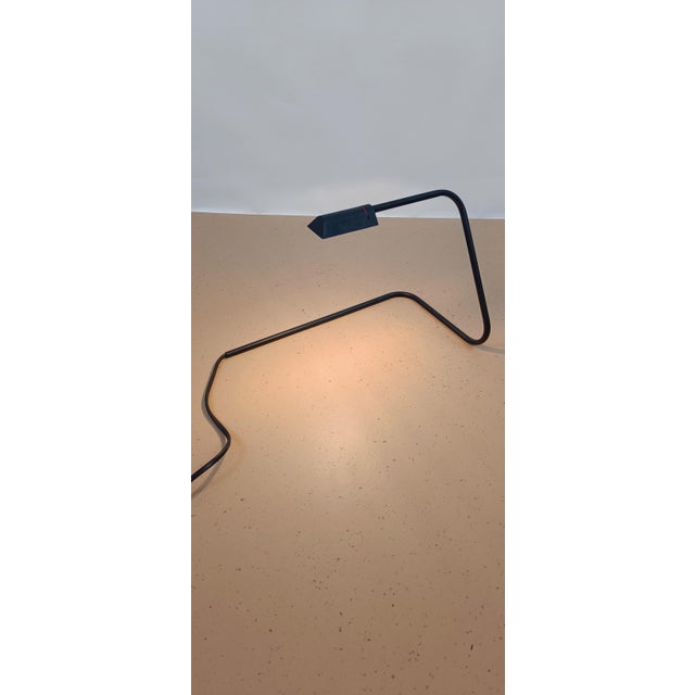 Beautiful minimalist table lamp from the Lumiance brand designed by Arnout Visser. The lamp is made of black painted...