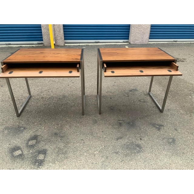 Pair of walnut/chrome modern end tables. The tables have a drawer.. folds down. Table is solid walnut on top and sides....