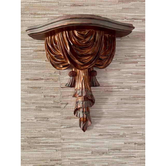 large vintage decorative wall shelf with carving of drapes and tassels. This piece is large enough to anchor the wall or...