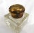 This is a large and I think older crystal inkwell that has some discoloration. It has an attached metal lid with an...