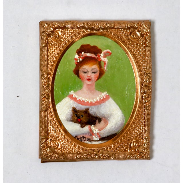 A charming miniature oil painting depicts a young woman with an elegant updo adorned with a hair ribbon, dressed in an...