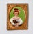 A charming miniature oil painting depicts a young woman with an elegant updo adorned with a hair ribbon, dressed in an...