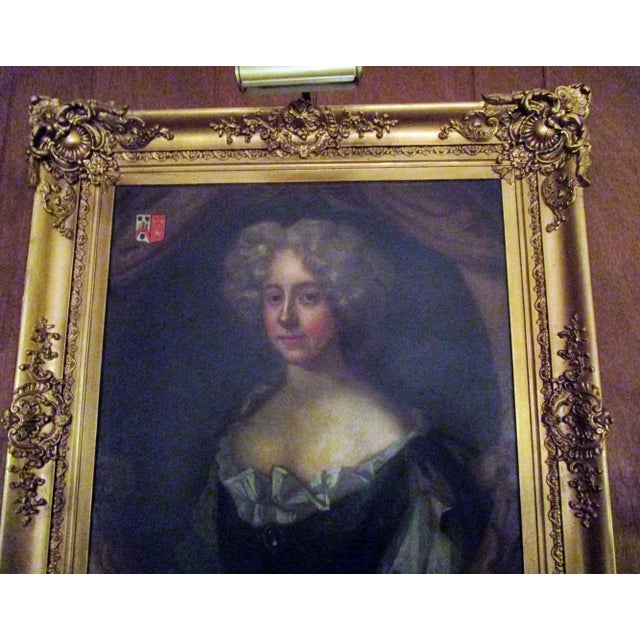 18th century English noblewoman in a gold gilt ornate period frame. Lovely detail and color, coat of arms in corner....