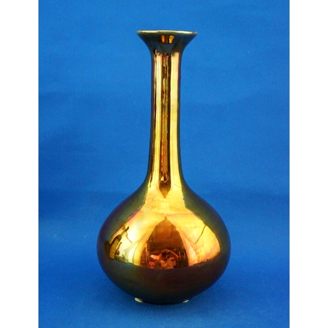 Item : a magnificent ceramic vase, entirely handcrafted on a wheel, glazed with rich gold metallic enamels and finished...