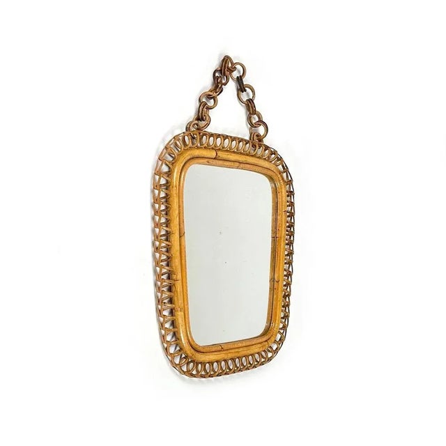 Midcentury beautiful squared wall mirror with chain in bamboo and rattan in the style of Italian design Franco Albini....