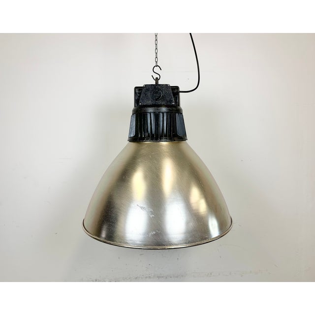 This pendant lamp was made by Elektrosvit and originally used in a factories in former Czechoslovakia in the 1960s. The...