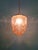 Art Deco Skyscraper pendant light in frosted pink glass with a brass mount, 1920s-30s. The pendant has been restored and...
