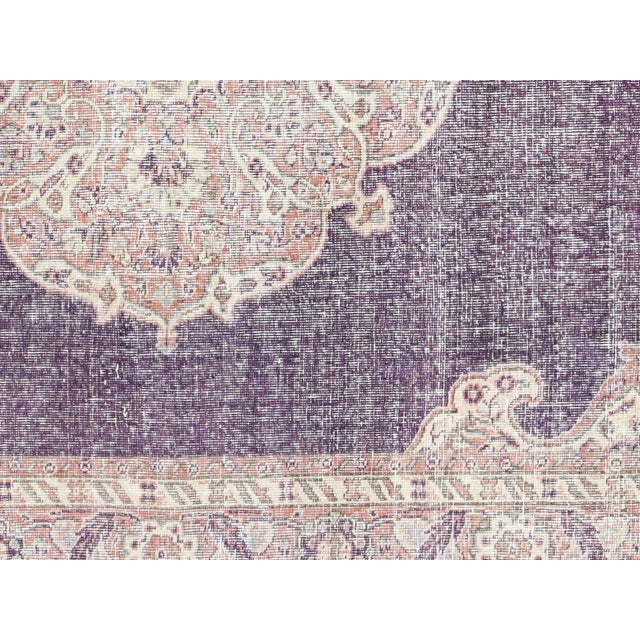 This Vintage Turkish Oushak Rug adds a vibrant touch to any home with its combination of wool and cotton. Measuring 6'11"...