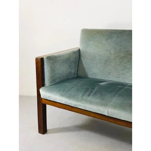 Beautiful three-seat sofa from 1940 attributed to Franco Albini in rosewood. The fabric used for the padding of the sofa...