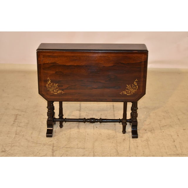19th century Sutherland table from England made form Rosewood. The top is fantastic and has lovely graining, inlaid with...