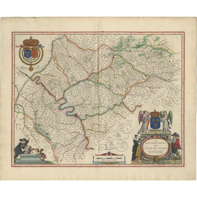 A richly detailed and highly decorative 17th-century map of the Île-de-France region, centered on Paris, published by...