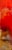 This artwork features a vibrant gradient of reds and warm earth tones, evoking the intense hues of a summer sunset. The...