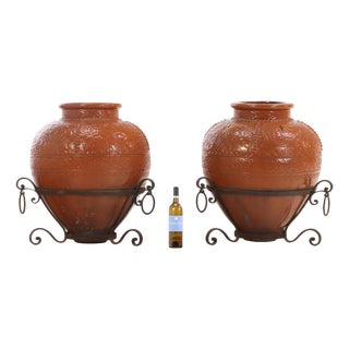 Pair of Spanish Earthenware Pots on Wrought Iron Bases, C. 1940 For Sale