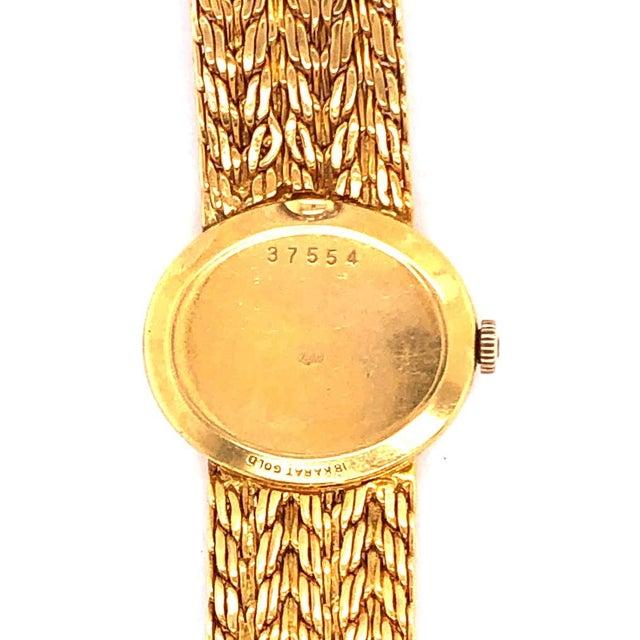 Tiffany & Co Attributed Stamped Ladies Universal Geneve 18 Karat Gold Watch and Band. Having an impressive 41.7 grams of...