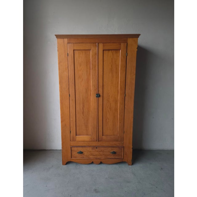 This antique European pine armoire features a warm, naturally aged finish, simple rustic charm and farmhouse style...