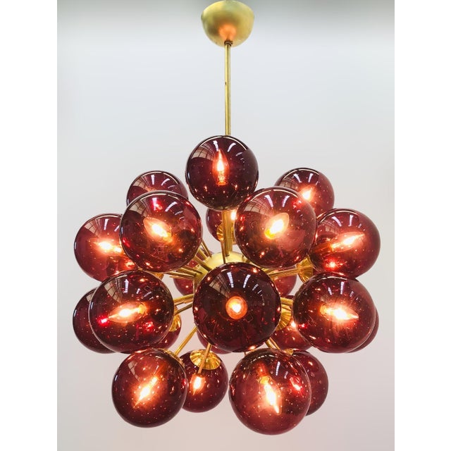Italian sputnik chandelier with 24 amethyst Murano glass globes carefully hand blown with bubbles inside the glass using...