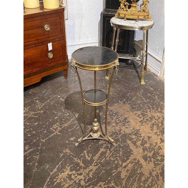 The French Empire Bronze and Marble Side Table is a luxurious and elegant piece of furniture . Crafted with lovely...