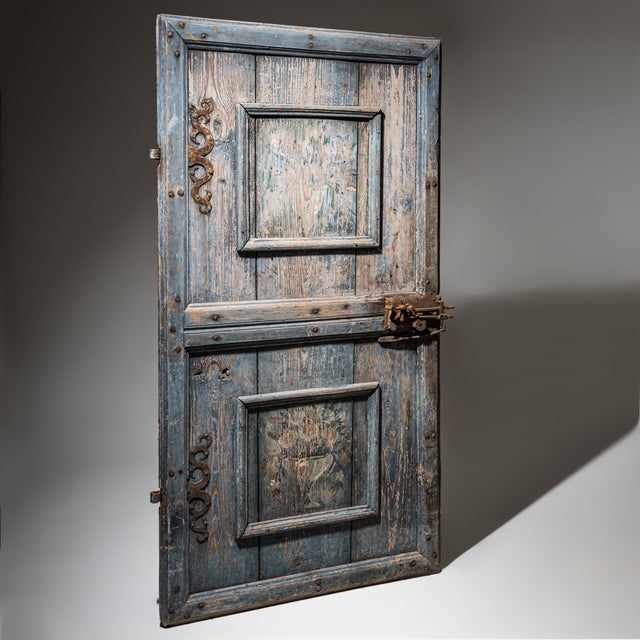 Baroque exterior door crafted from softwood, retaining its historic blue-painted finish and original iron fittings from...