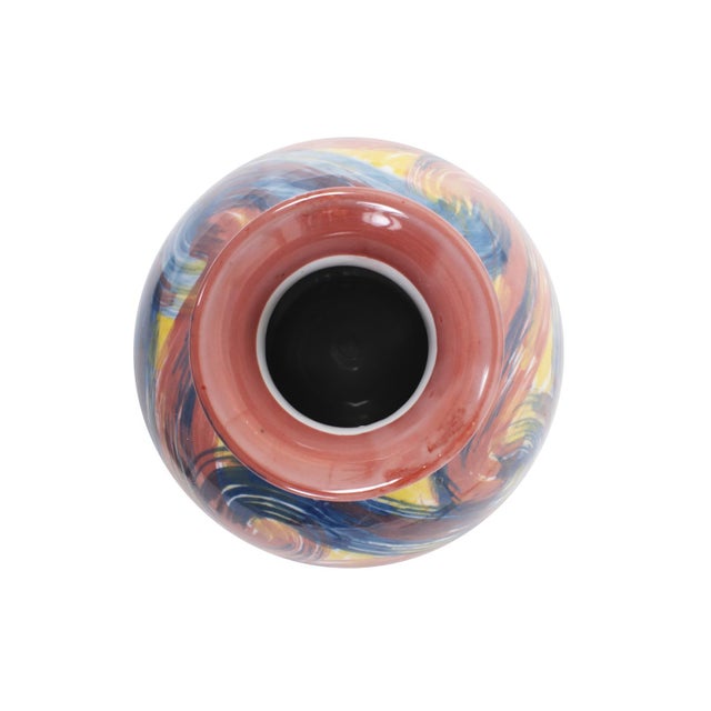 This vase boasts a unique and vibrant swirl of colors, reminiscent of brush strokes capturing the essence of blue skies,...